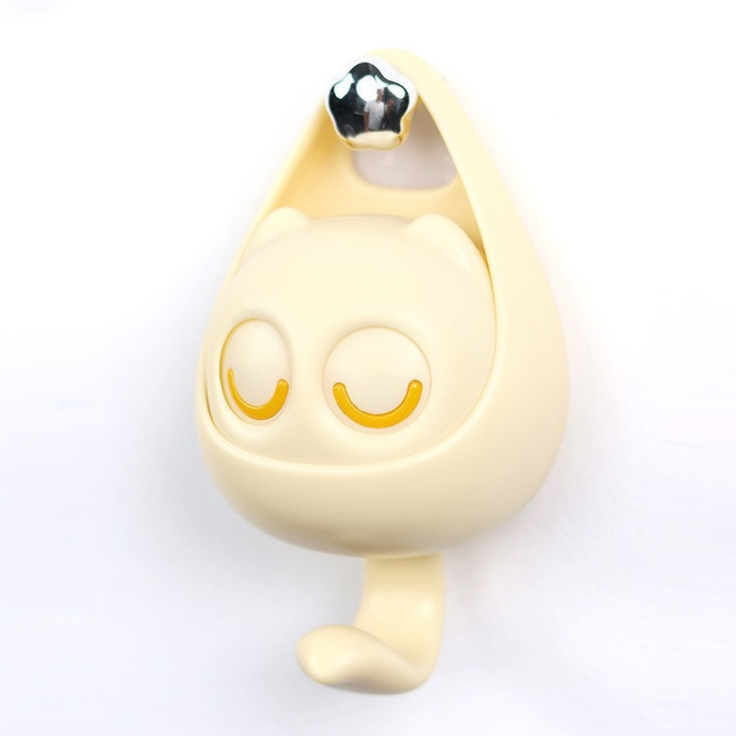Small, round, beige object with a gold accent on a white background
