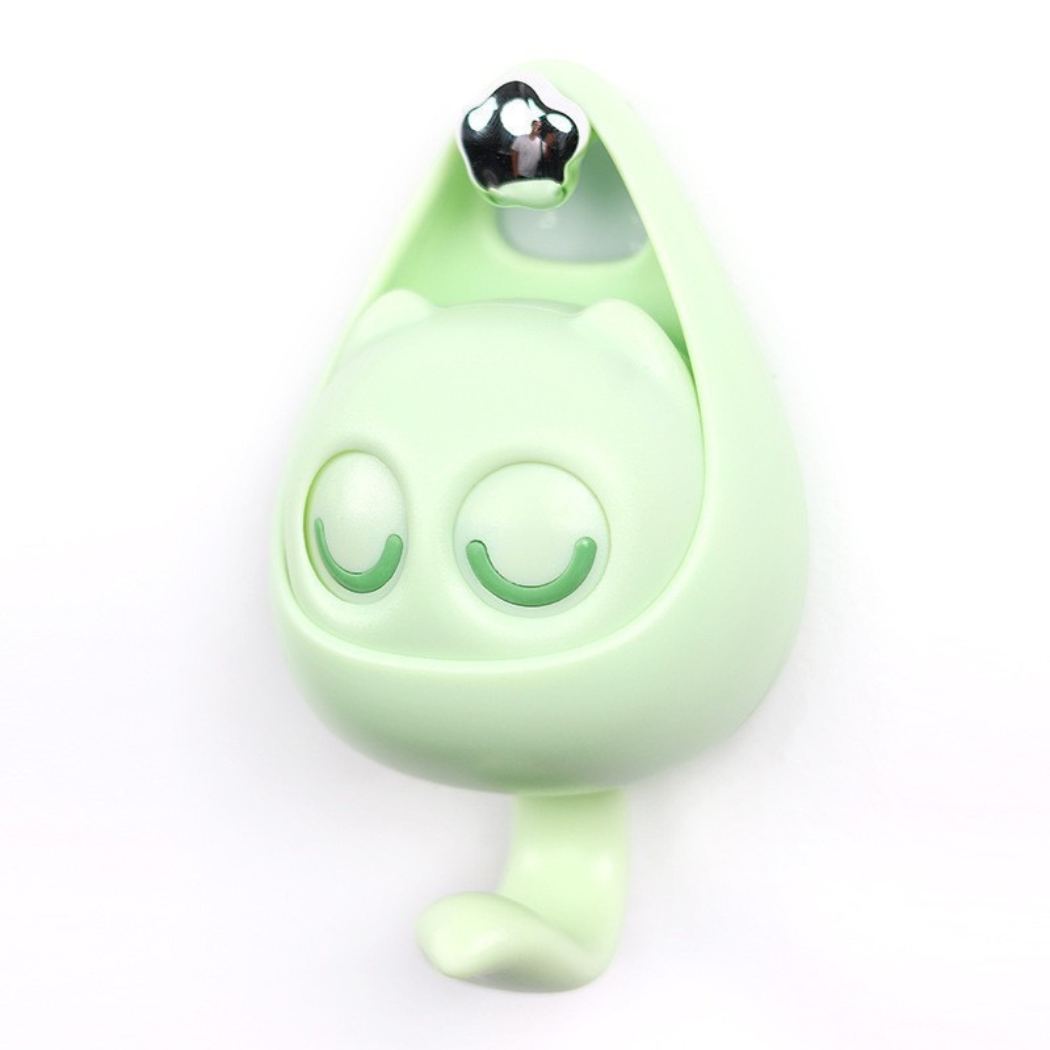 Green cartoon-like character with a shiny black top on a white background